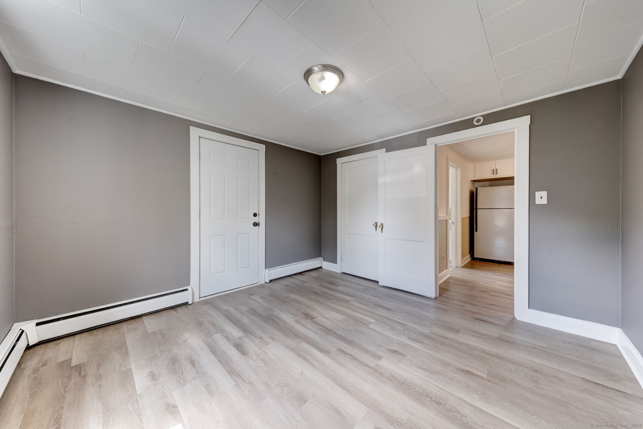 40 Mortimer Street, Unit 3 Torrington, CT 06790 - Photo 7 of 20 a view of an empty room with wooden floor