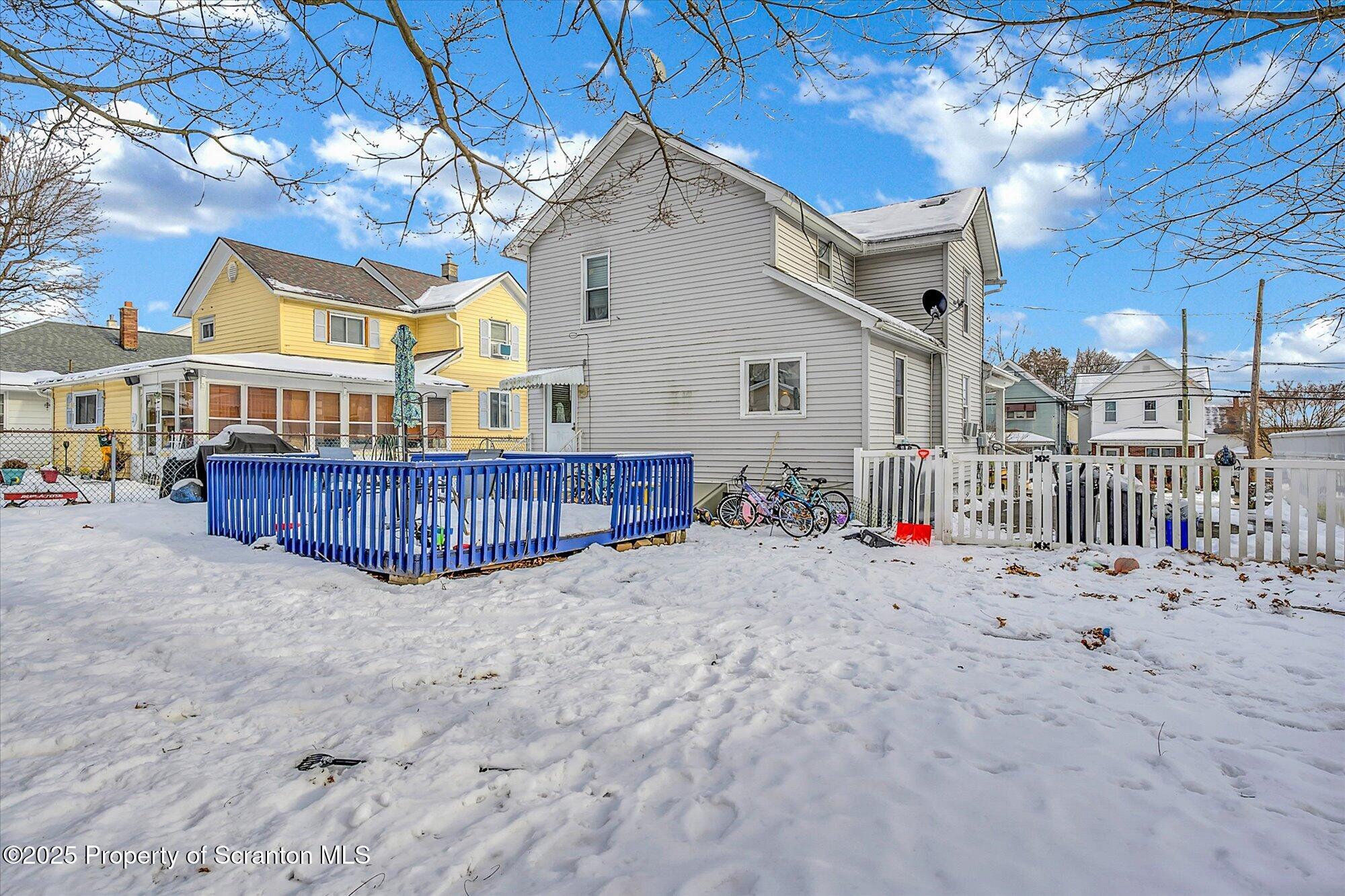219 1st Street Olyphant, PA 18447 - Photo 11 of 43 a view of a house with a yard and deck