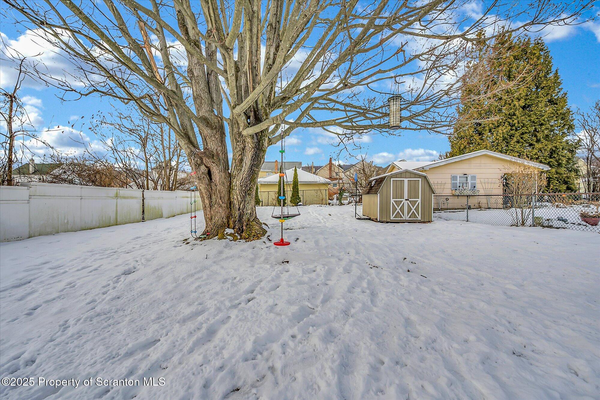 219 1st Street Olyphant, PA 18447 - Photo 12 of 43 a view of backyard and trees