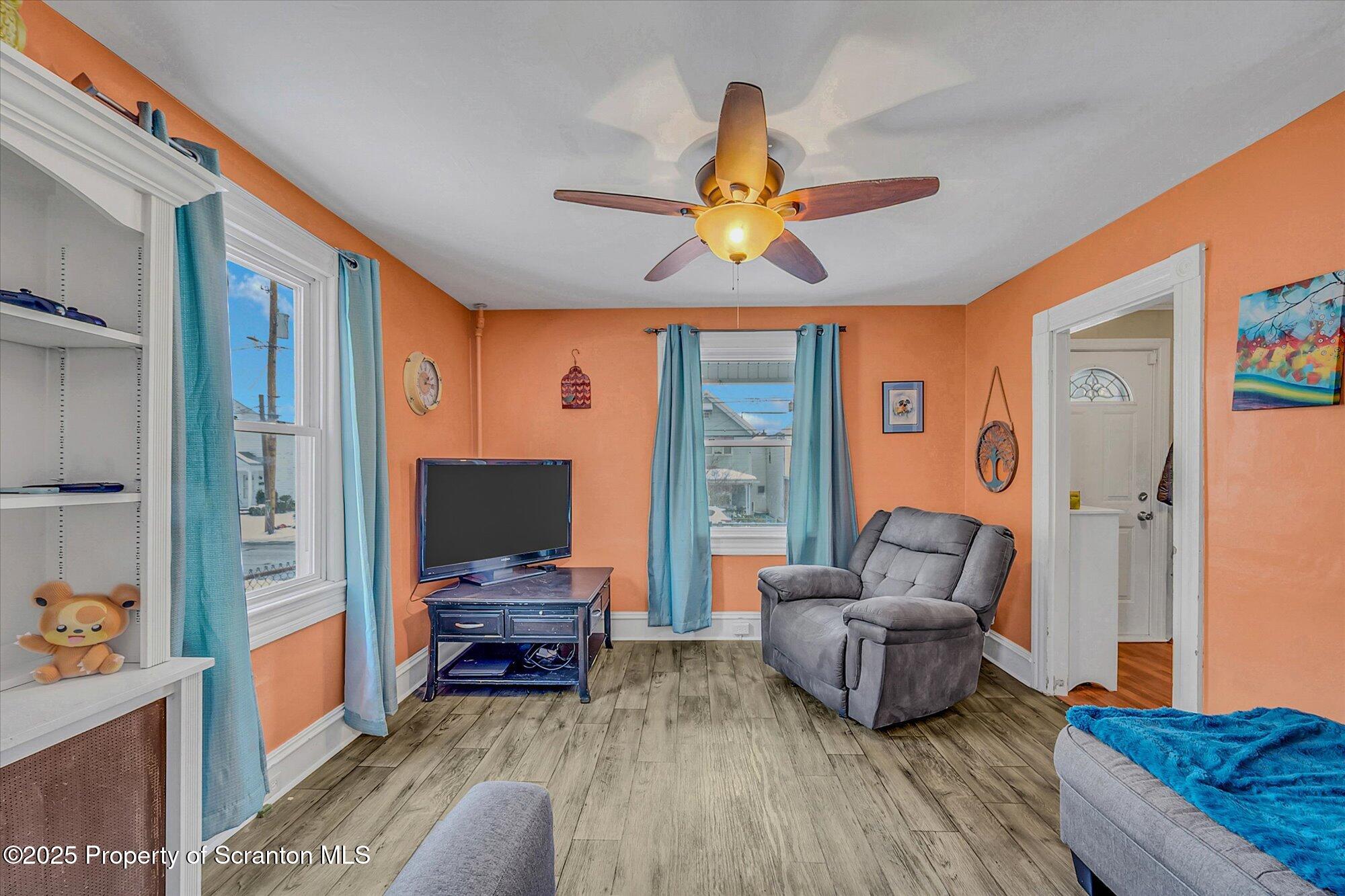 219 1st Street Olyphant, PA 18447 - Photo 15 of 43 a living room with furniture and a flat screen tv