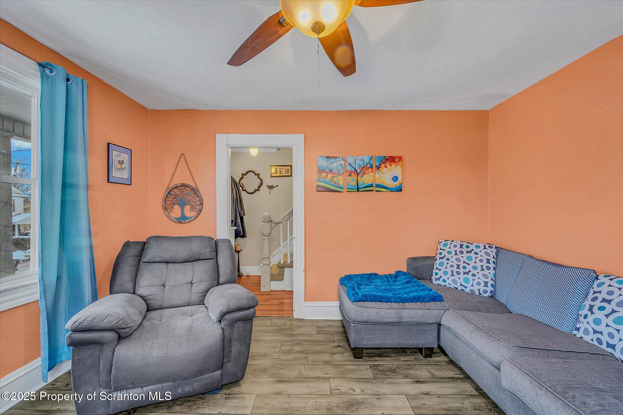 219 1st Street Olyphant, PA 18447 - Photo 16 of 43 a living room with furniture and a couch
