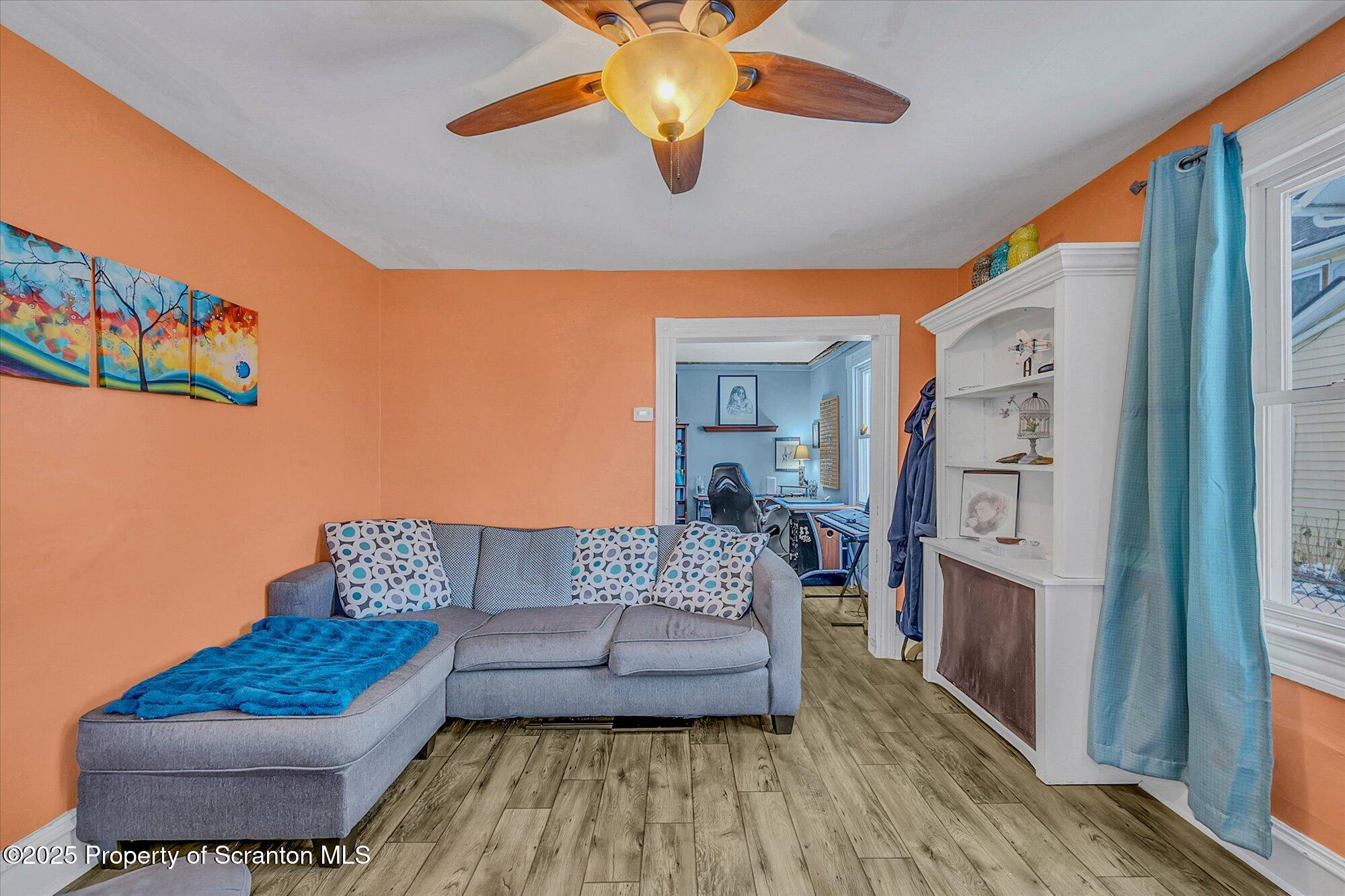 219 1st Street Olyphant, PA 18447 - Photo 17 of 43 a living room with furniture and wooden floor