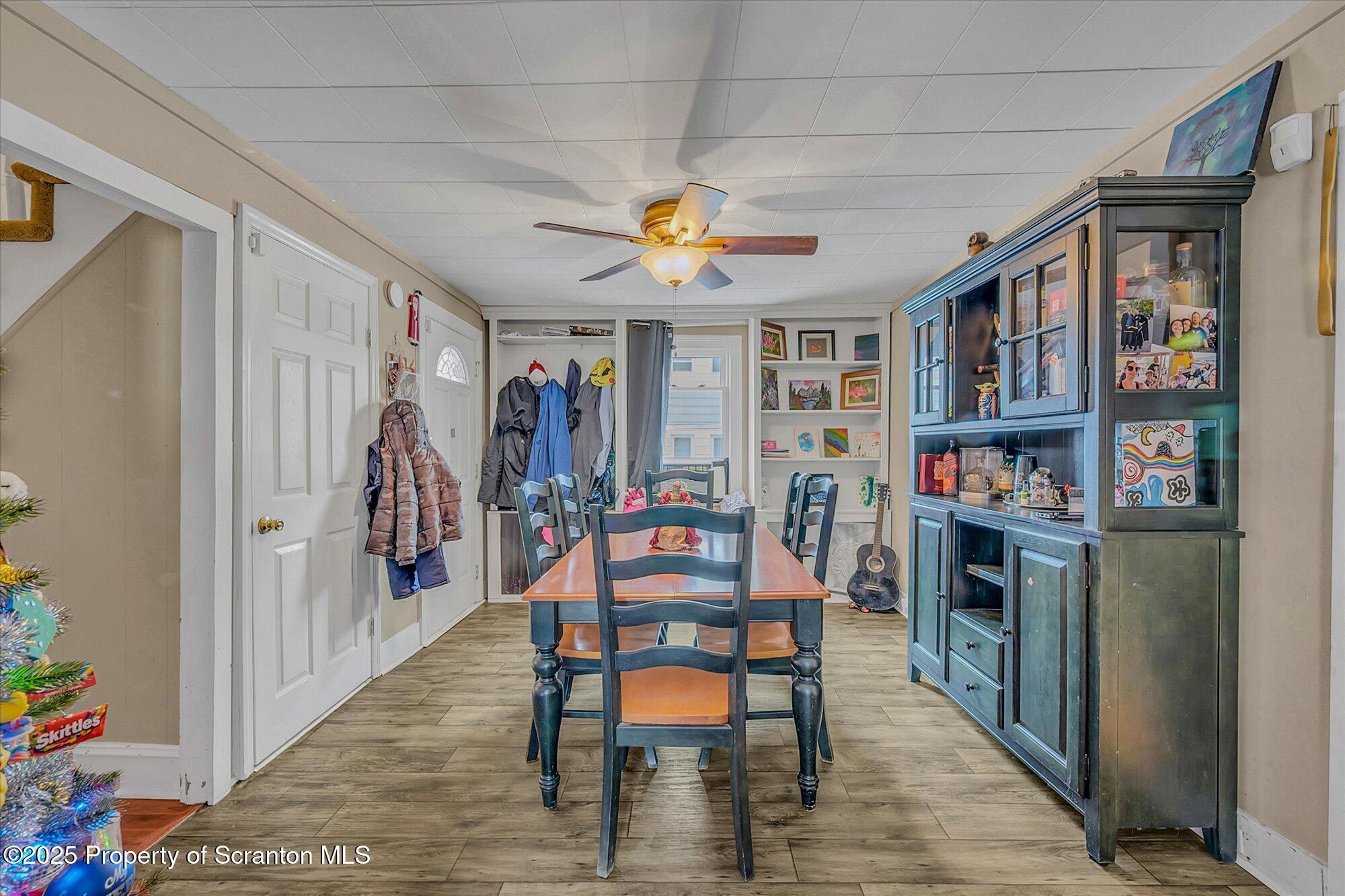 219 1st Street Olyphant, PA 18447 - Photo 20 of 43 a dining room with furniture a rug and wooden floor