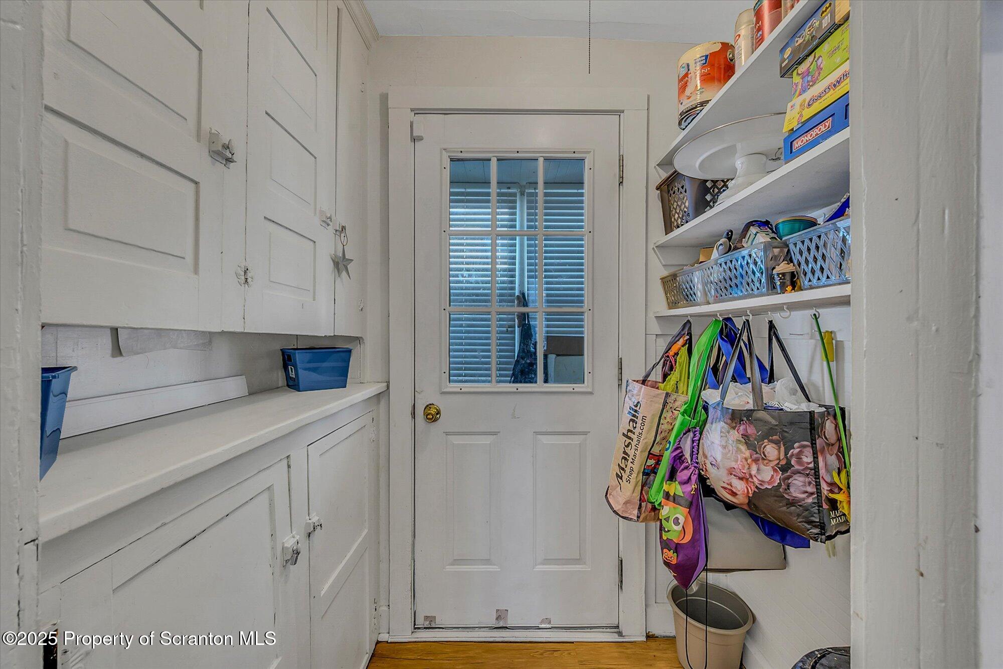 219 1st Street Olyphant, PA 18447 - Photo 27 of 43 a view of walk in closet with clothes