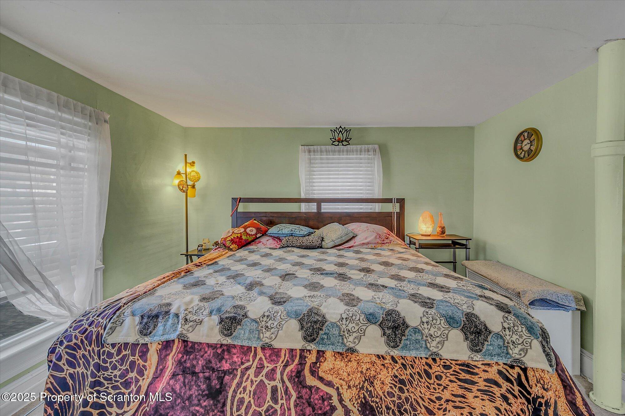 219 1st Street Olyphant, PA 18447 - Photo 30 of 43 a bedroom with a bed and window