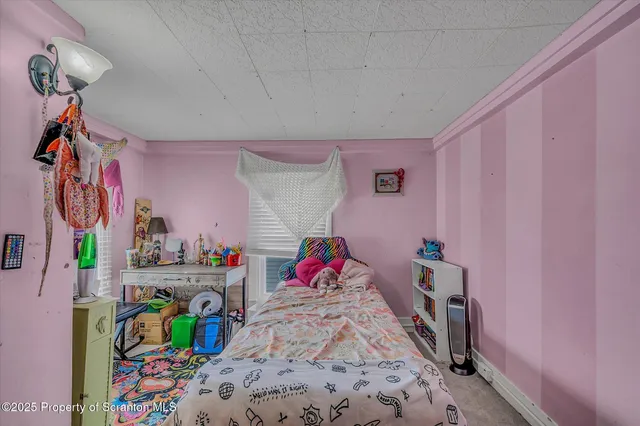 a bedroom with a bed and a bed