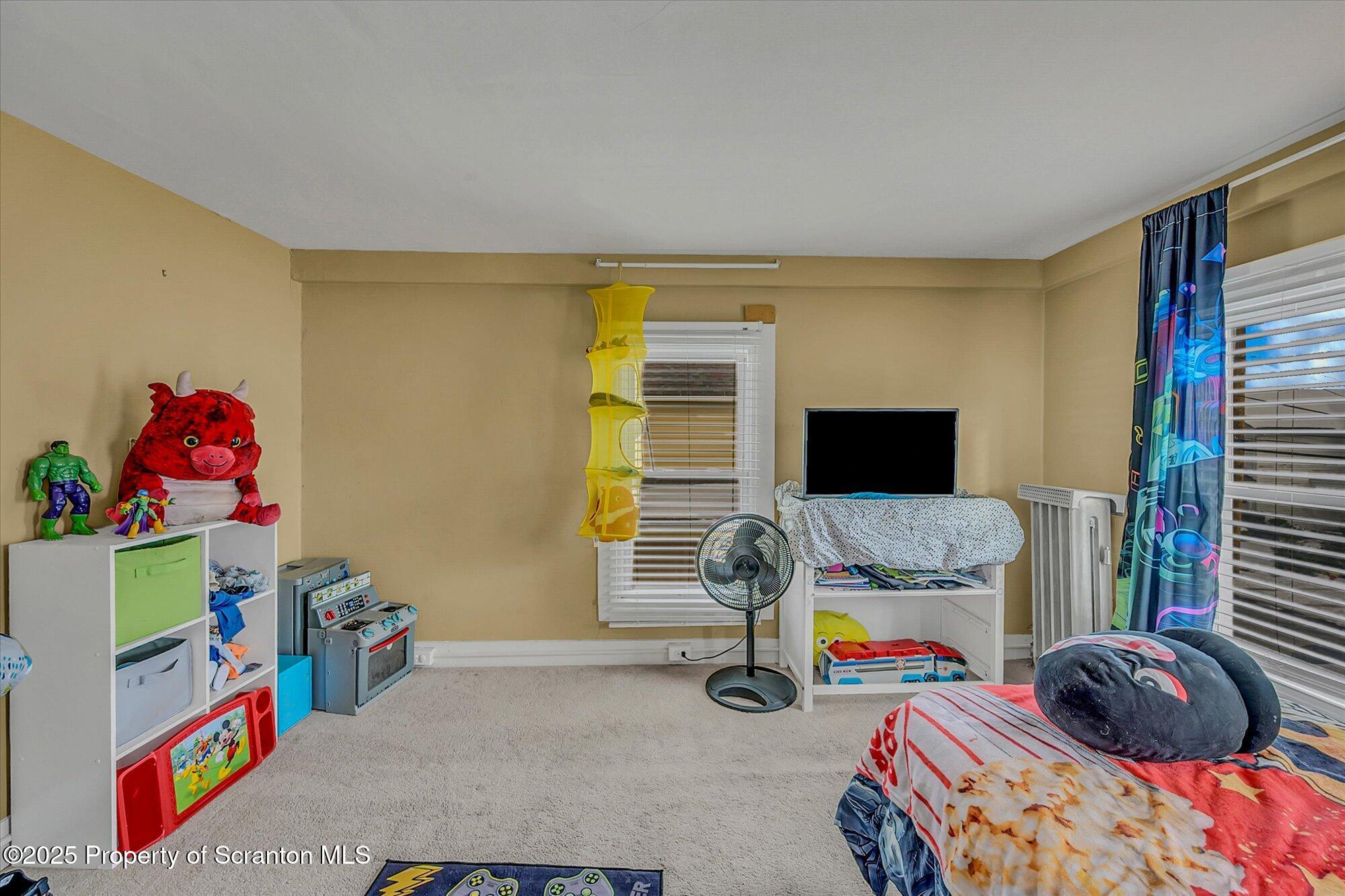 219 1st Street Olyphant, PA 18447 - Photo 37 of 43 a bedroom with a bed and a window