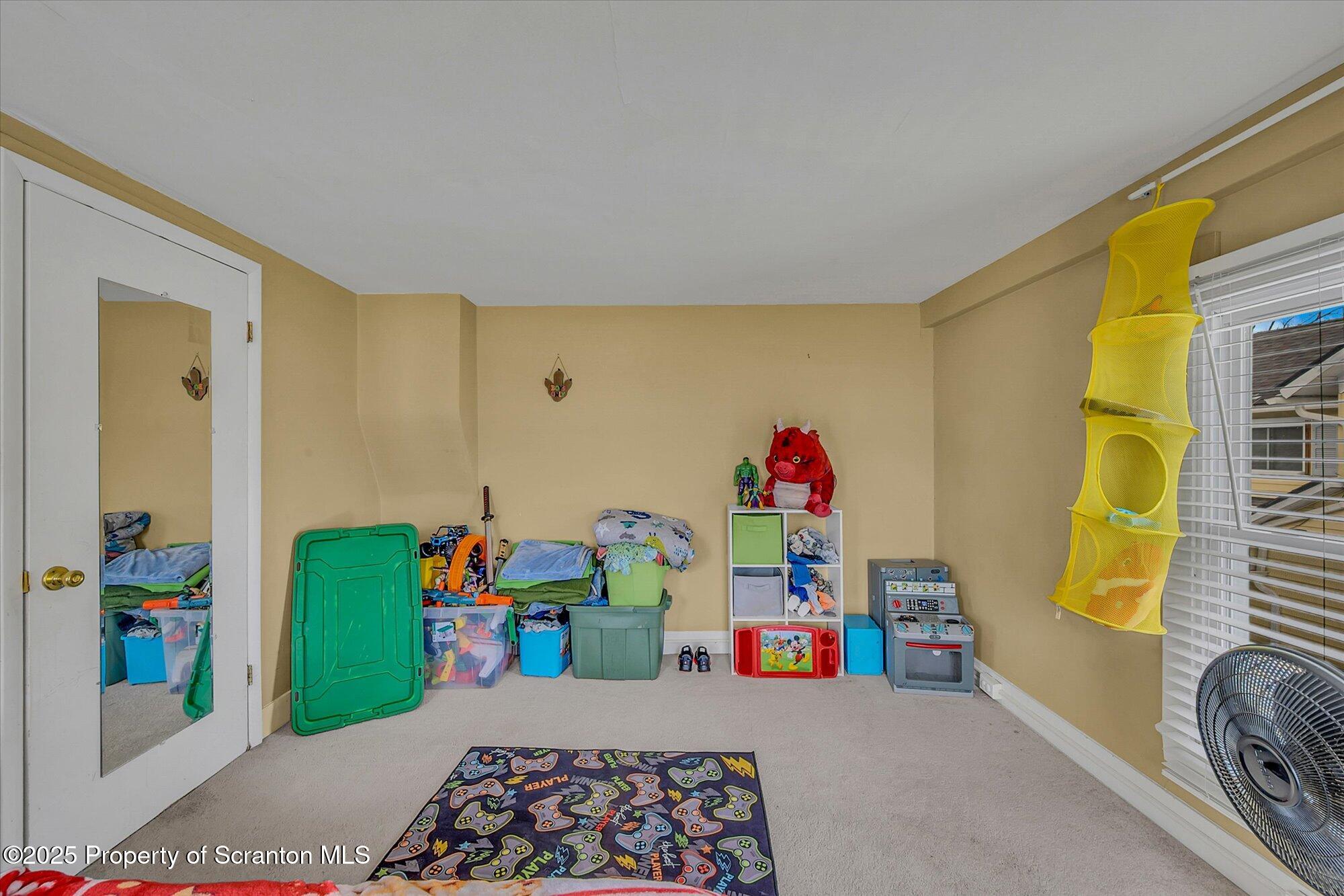 219 1st Street Olyphant, PA 18447 - Photo 38 of 43 a bedroom with toys and a book shelf