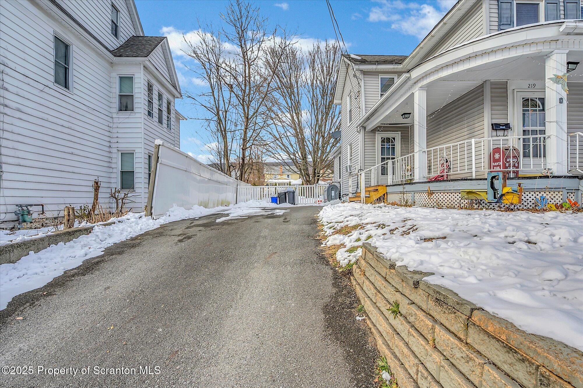 219 1st Street Olyphant, PA 18447 - Photo 6 of 43 a view of a street with buildings