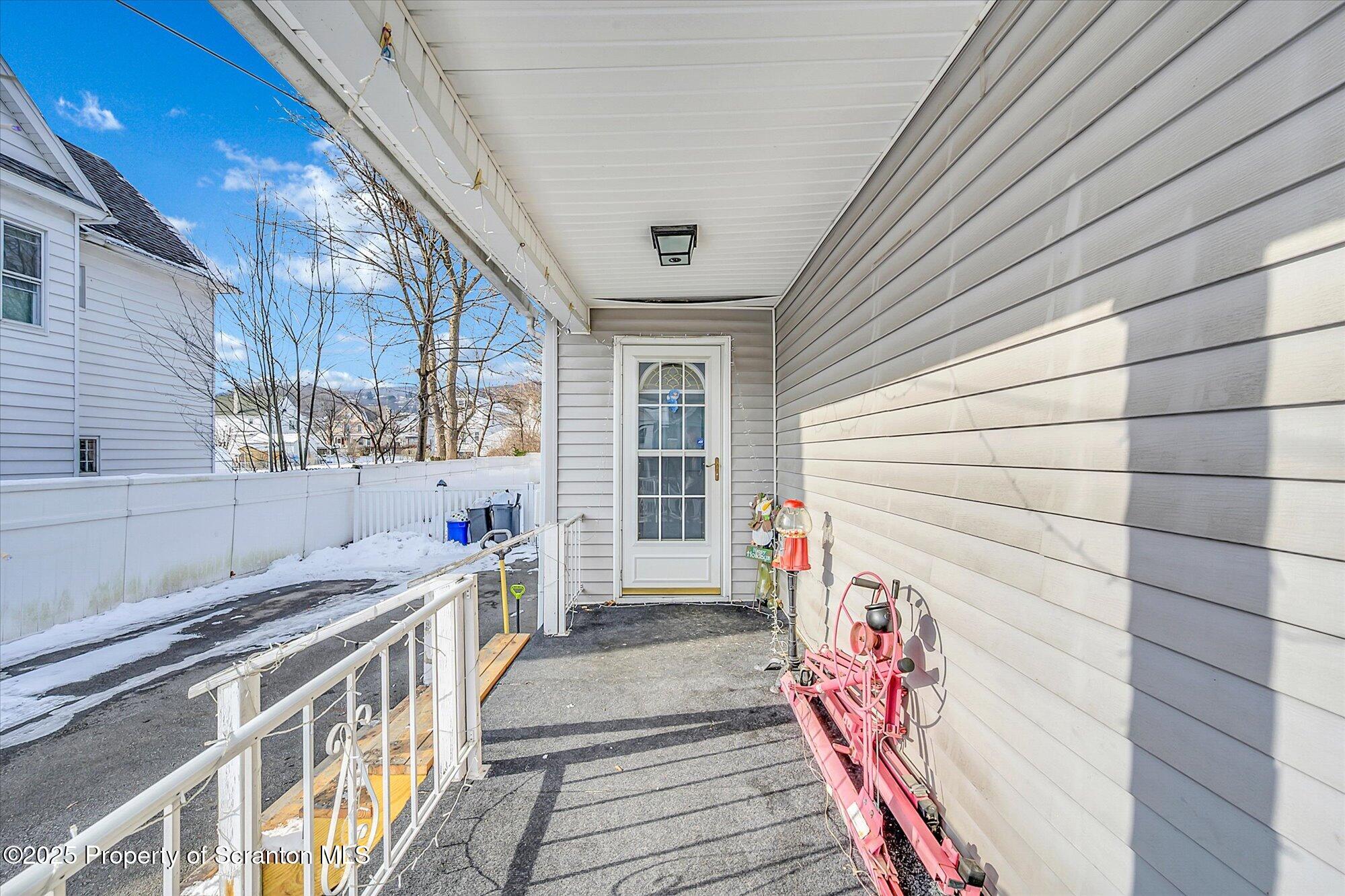 219 1st Street Olyphant, PA 18447 - Photo 8 of 43 a view of a house with a balcony