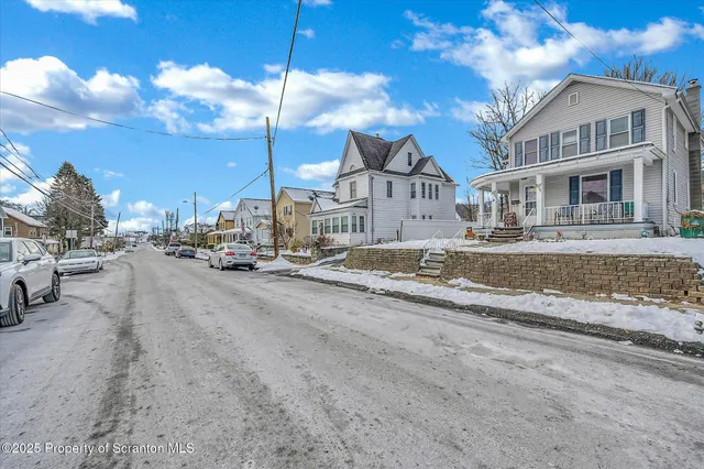 a view of a street with a building in the background