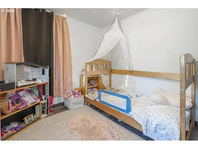 a bedroom with a bed and a mirror