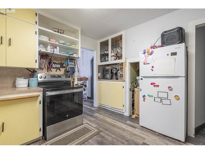 42111 Highway 226 Scio, OR 97374 - Photo 9 of 23 a white refrigerator freezer sitting inside of a kitchen