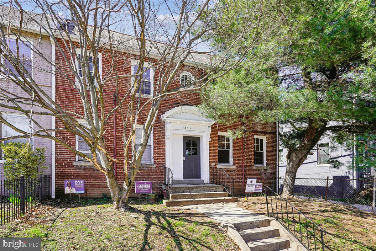3944 7th Street Northeast, Unit 4 Washington, DC 20017 - Photo 2 of 19 a front view of a house with a yard