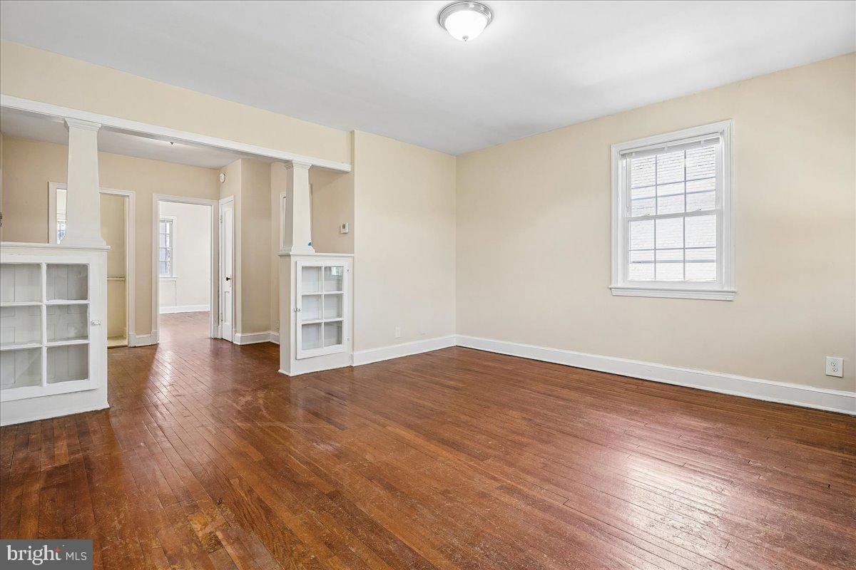 3944 7th Street Northeast, Unit 4 Washington, DC 20017 - Photo 6 of 19 wooden floor in an empty room with a window