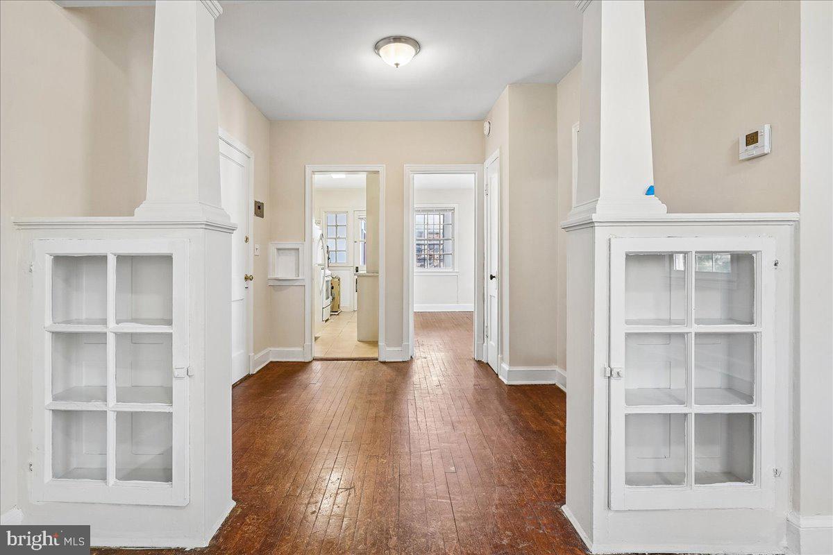 3944 7th Street Northeast, Unit 4 Washington, DC 20017 - Photo 9 of 19 an empty room with wooden floor and windows