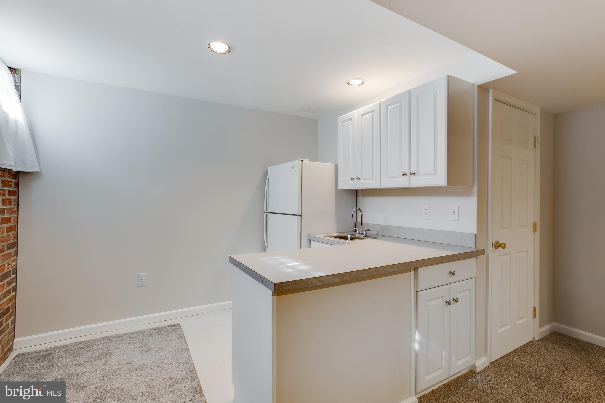 19064 Staleybridge Road Germantown, MD 20876 - Photo 28 of 37 Kitchenette with counters and cabinets