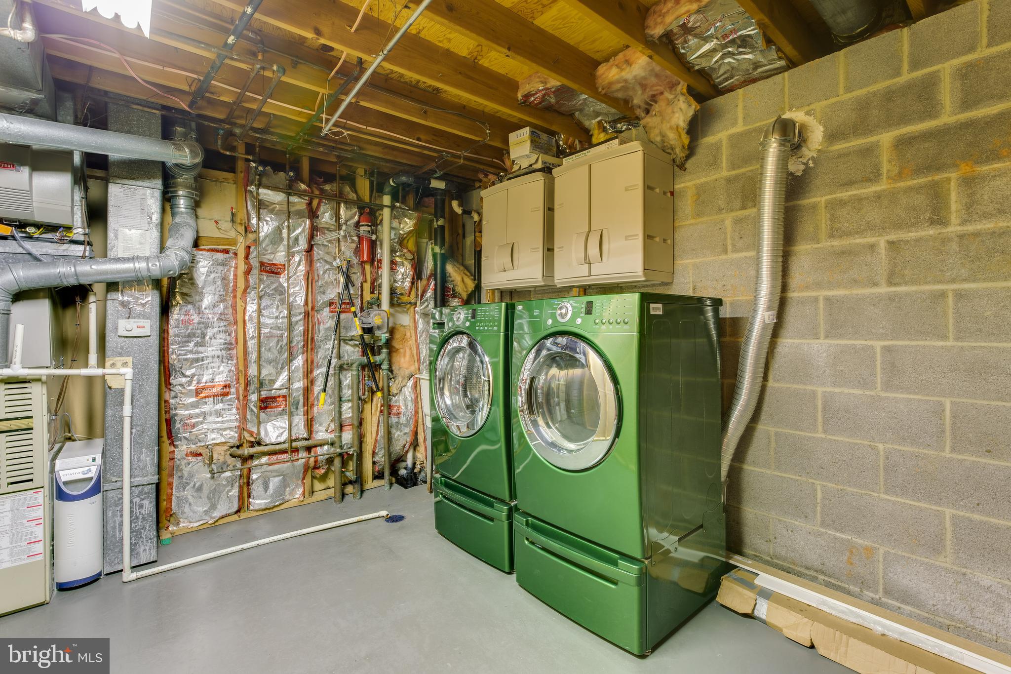 19064 Staleybridge Road Germantown, MD 20876 - Photo 31 of 37 Utility Room with front loading Washer/Dryer