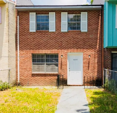 a front view of a house having yard