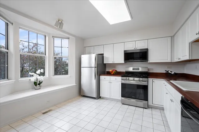 a kitchen with a stove a sink and a refrigerator