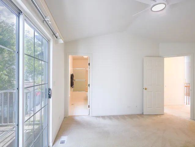 a view of an empty room and a window