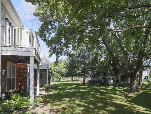 a backyard of a house with lots of green space