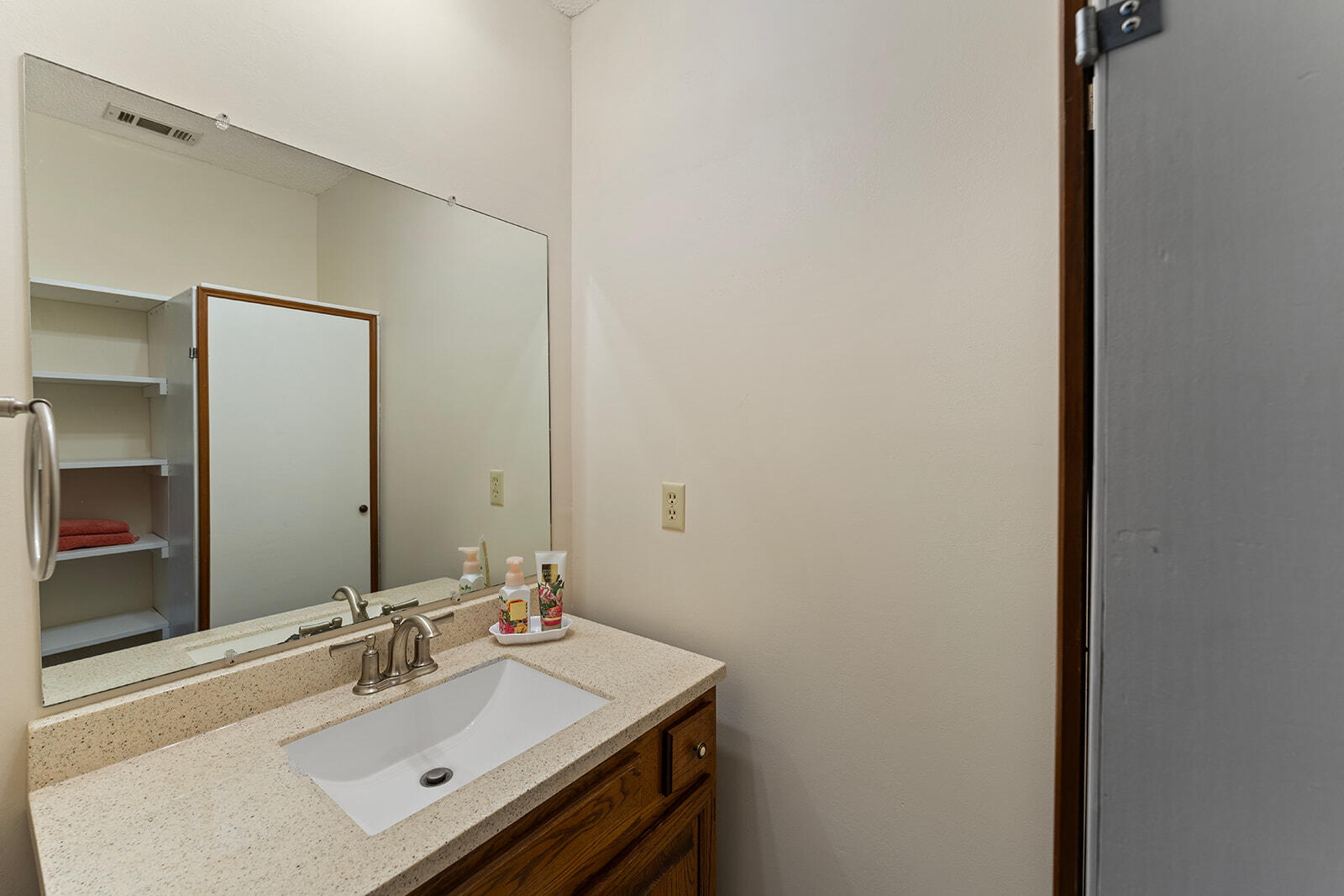 3687 Airport Road Crestview, FL 32539 - Photo 27 of 74 a bathroom with a sink vanity and a mirror