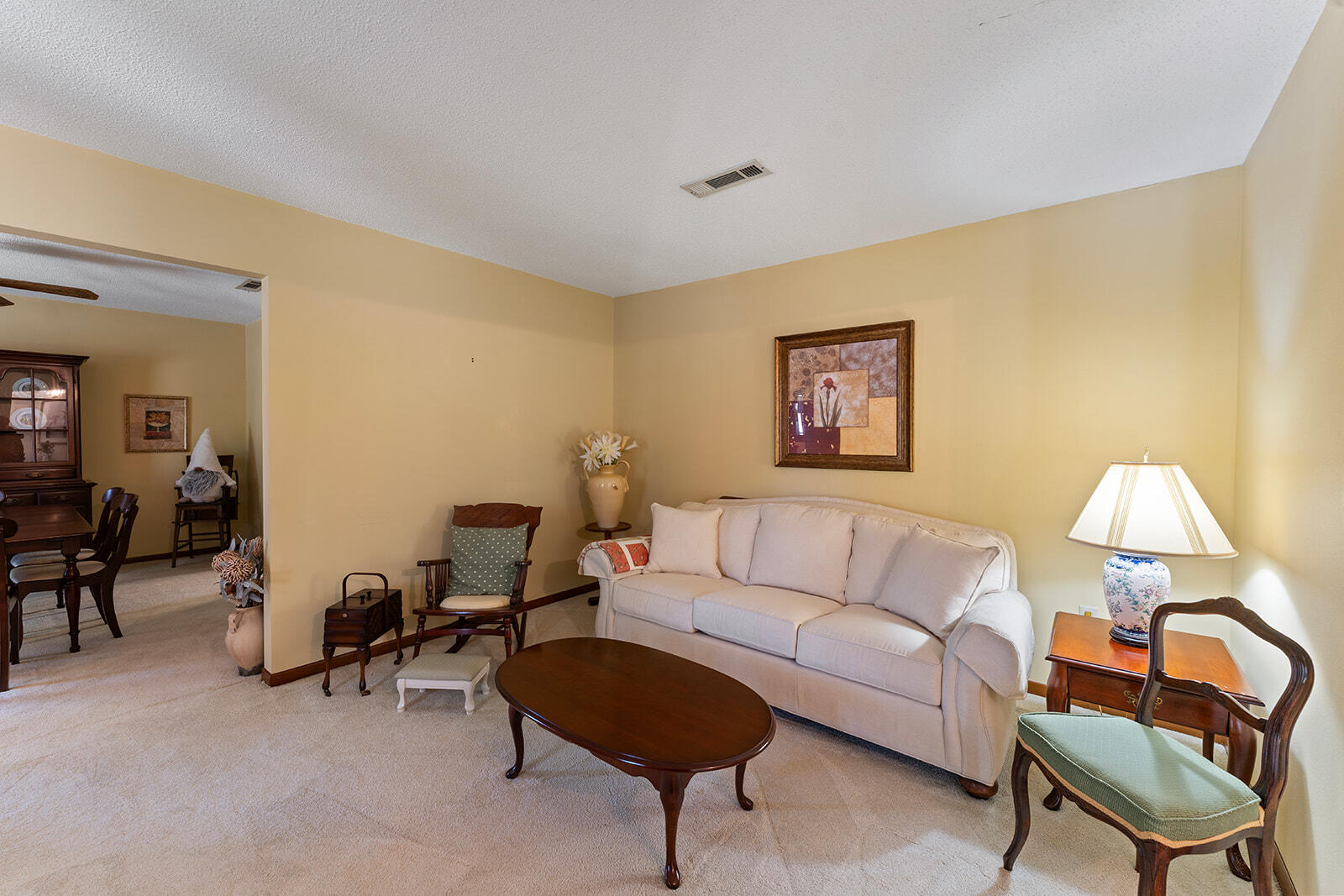 3687 Airport Road Crestview, FL 32539 - Photo 52 of 74 a living room with furniture and a lamp