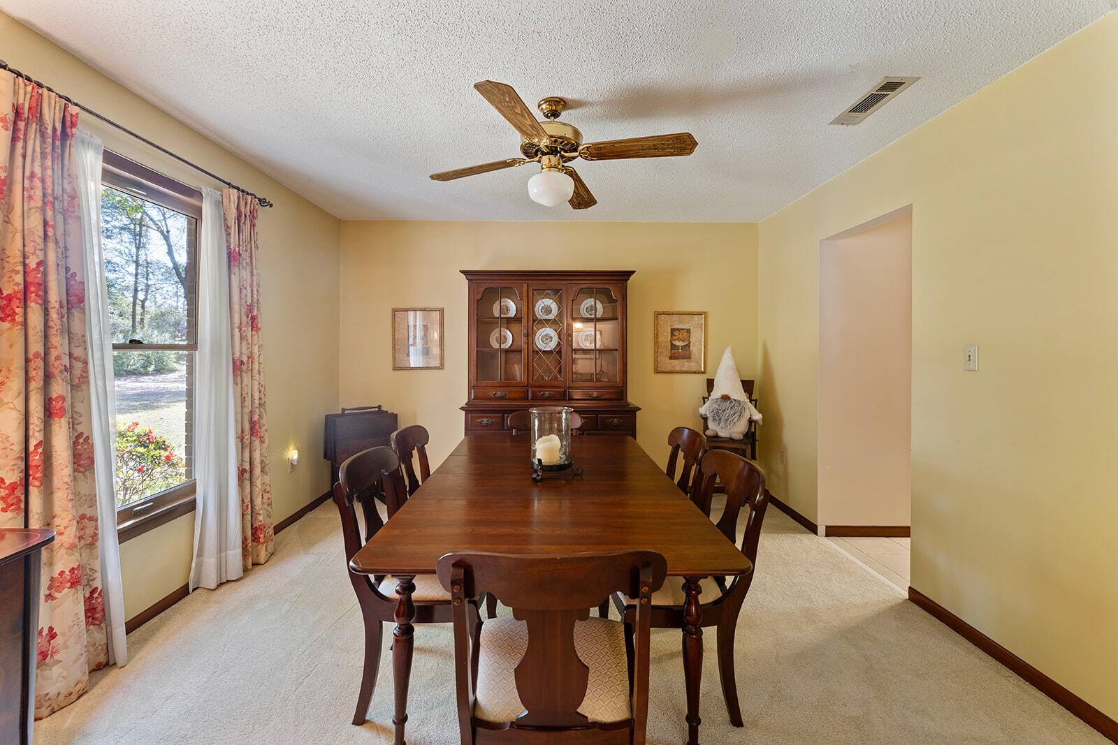 3687 Airport Road Crestview, FL 32539 - Photo 54 of 74 a dining room with furniture and window