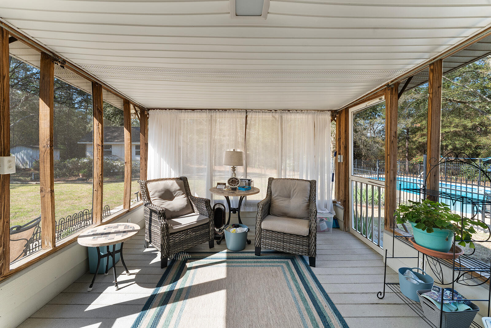 3687 Airport Road Crestview, FL 32539 - Photo 58 of 74 a living room with furniture and floor to ceiling windows