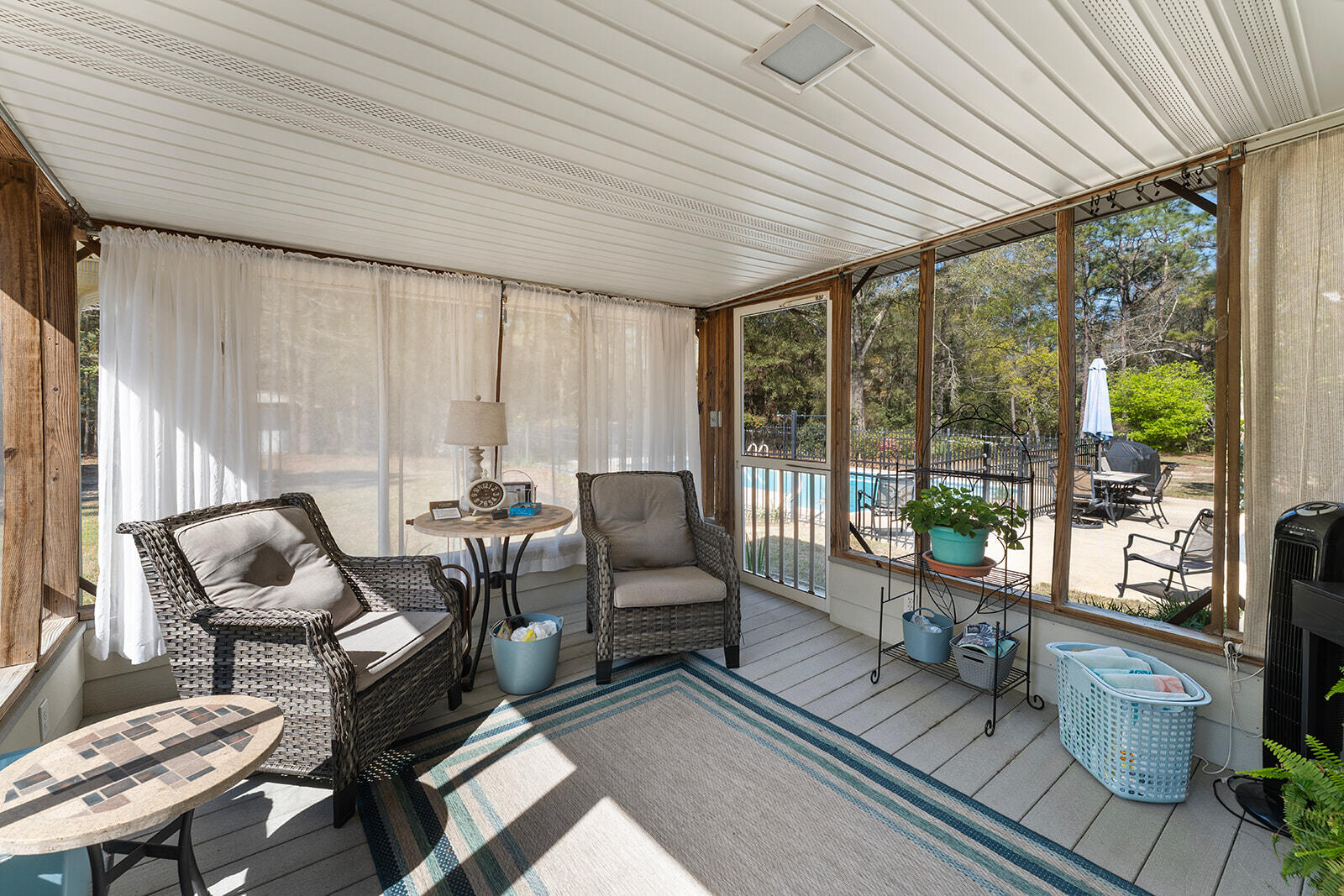 3687 Airport Road Crestview, FL 32539 - Photo 59 of 74 a living room with furniture and a floor to ceiling window
