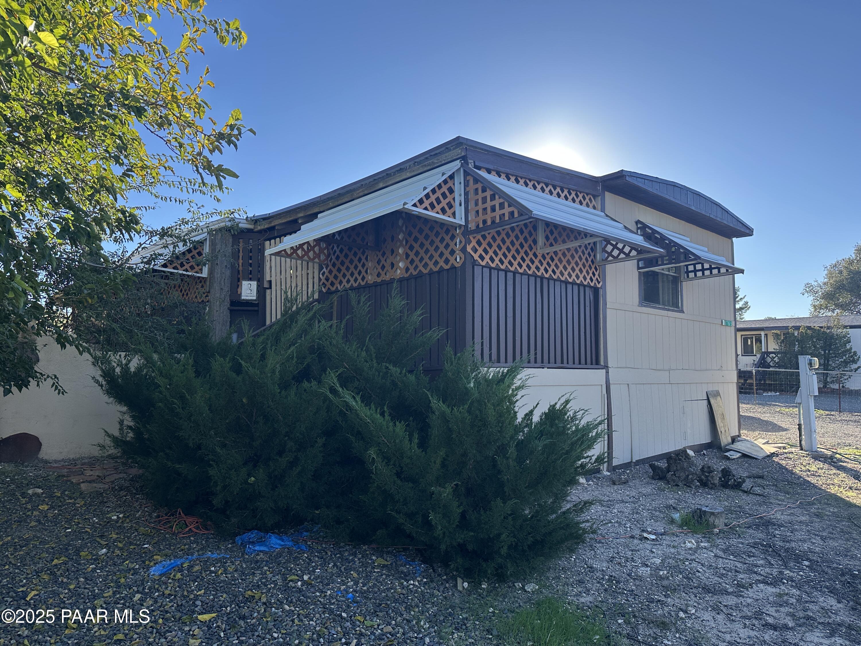 20765 East Larry Lane Mayer, AZ 86333 - Photo 1 of 26 a backyard of a house with lots of green space