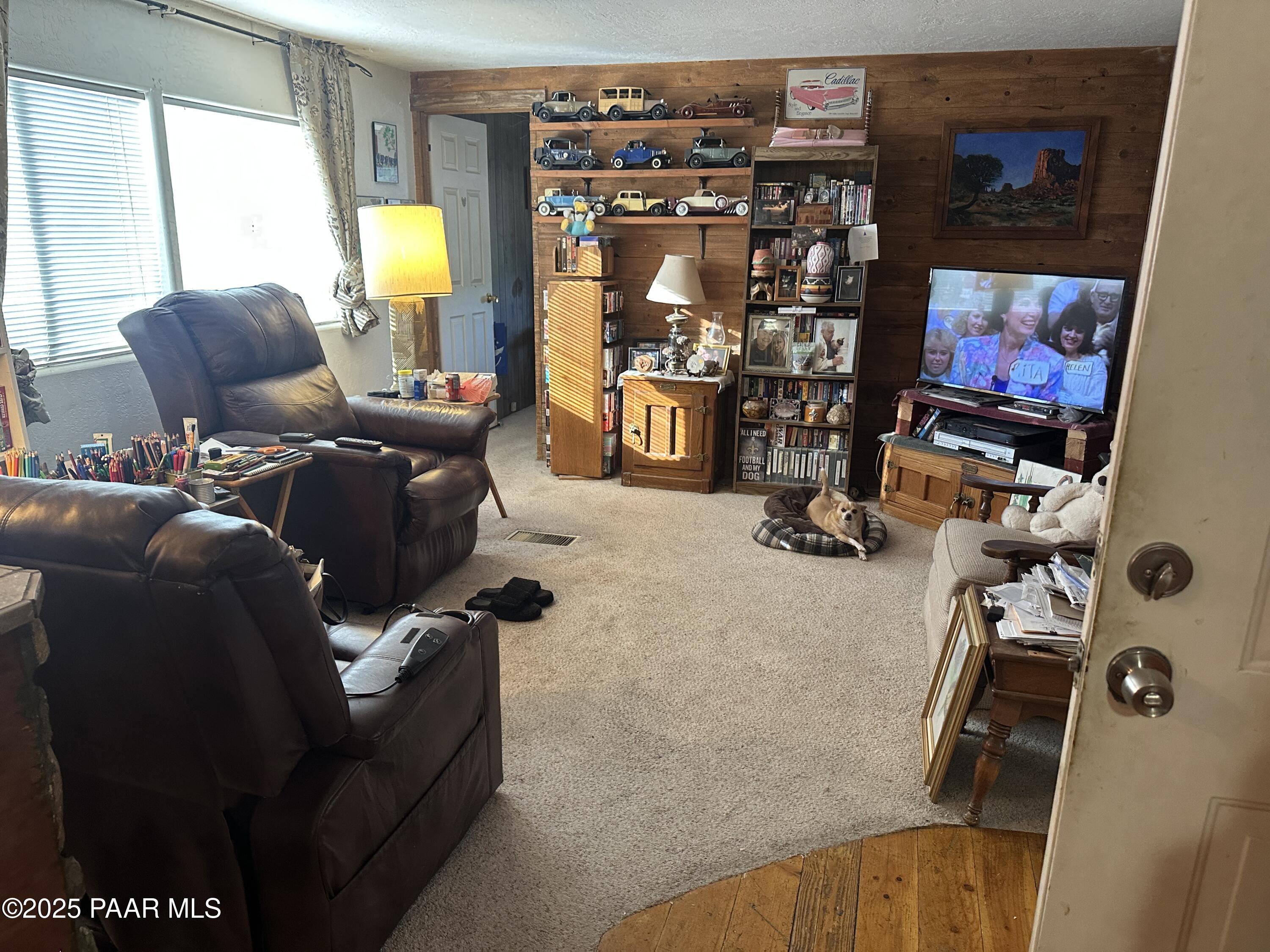 20765 East Larry Lane Mayer, AZ 86333 - Photo 11 of 26 a room with furniture and a flat screen tv