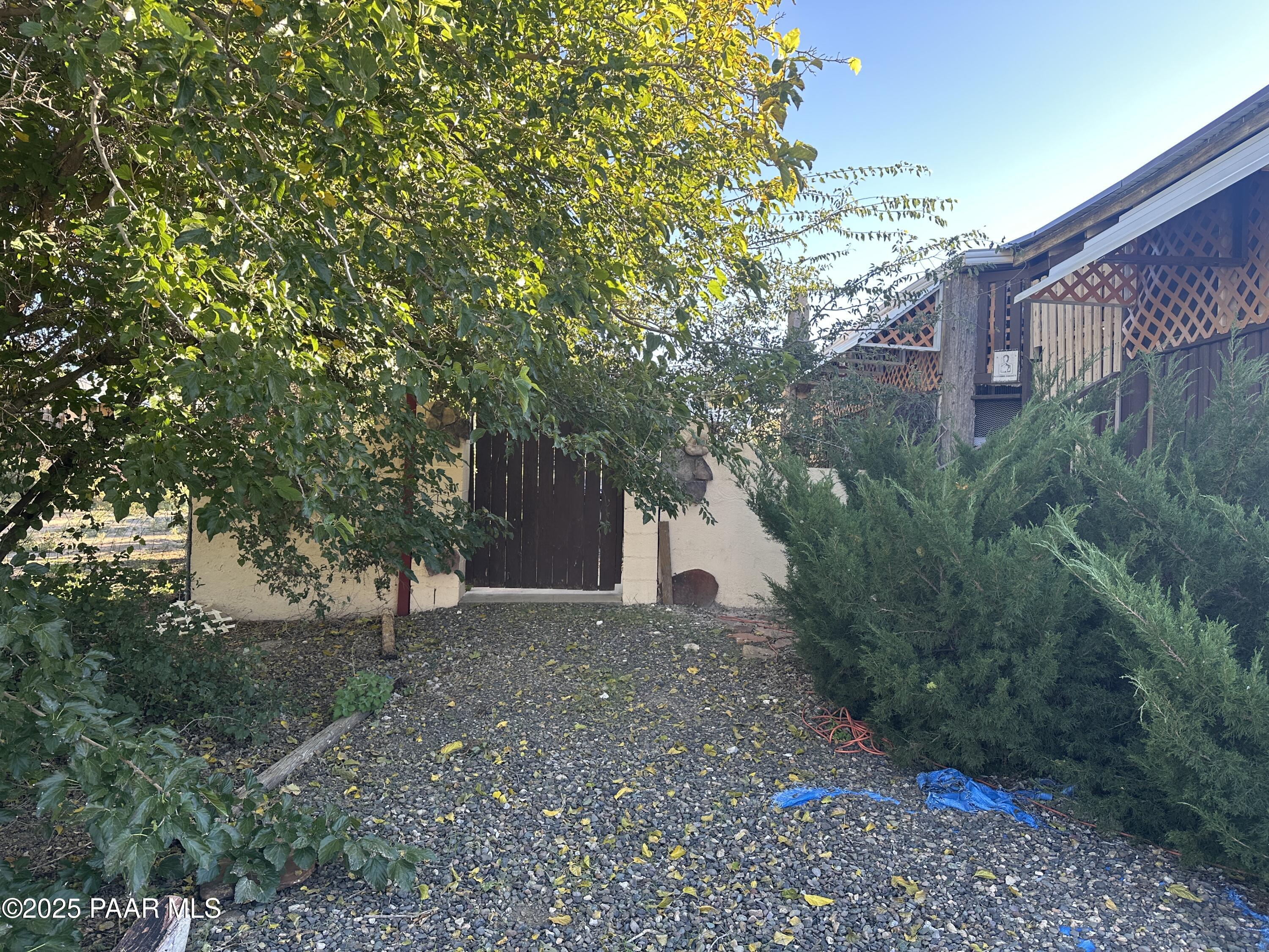 20765 East Larry Lane Mayer, AZ 86333 - Photo 2 of 26 a view of backyard with plants and trees