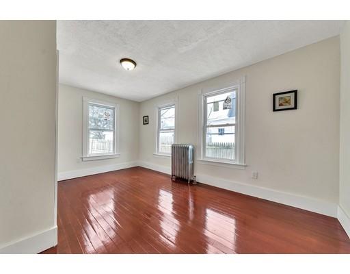 47 Jasper Street Springfield, MA 01109 - Photo 5 of 29 a view of an empty room with wooden floor and a window