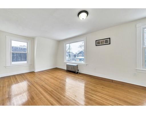47 Jasper Street Springfield, MA 01109 - Photo 9 of 29 a view of an empty room with window and wooden floor