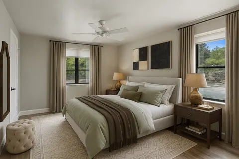 a bedroom with a large bed and a window