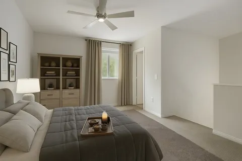 a bedroom with furniture and a window