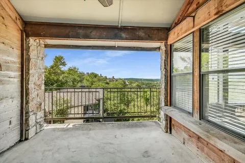 a view of a balcony with an outdoor space