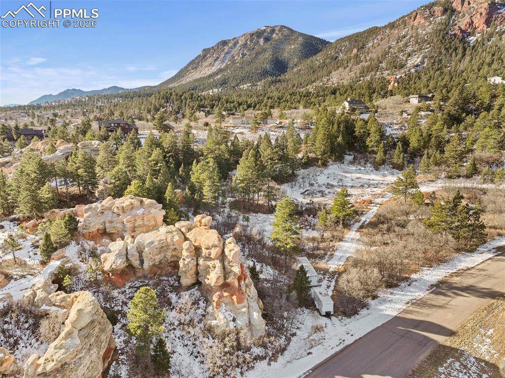 a view of a field with mountains in the background