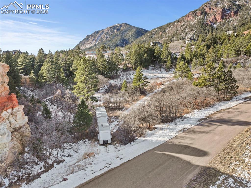 4549 Redstone Ridge Road Monument, CO 80132 - Photo 21 of 50 a view of a road with mountain view