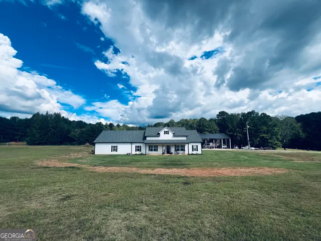 a view of a house with a big yard