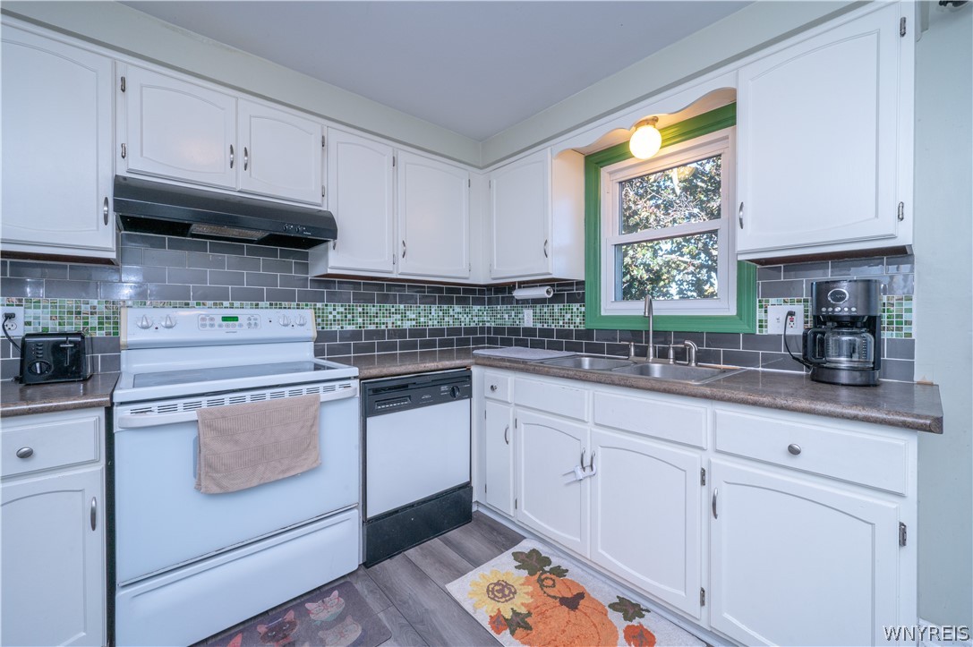 6463 Ward Road Sanborn, NY 14132 - Photo 17 of 49 Ample cabinetry and detailed tile backsplashes define this classic cooking space.