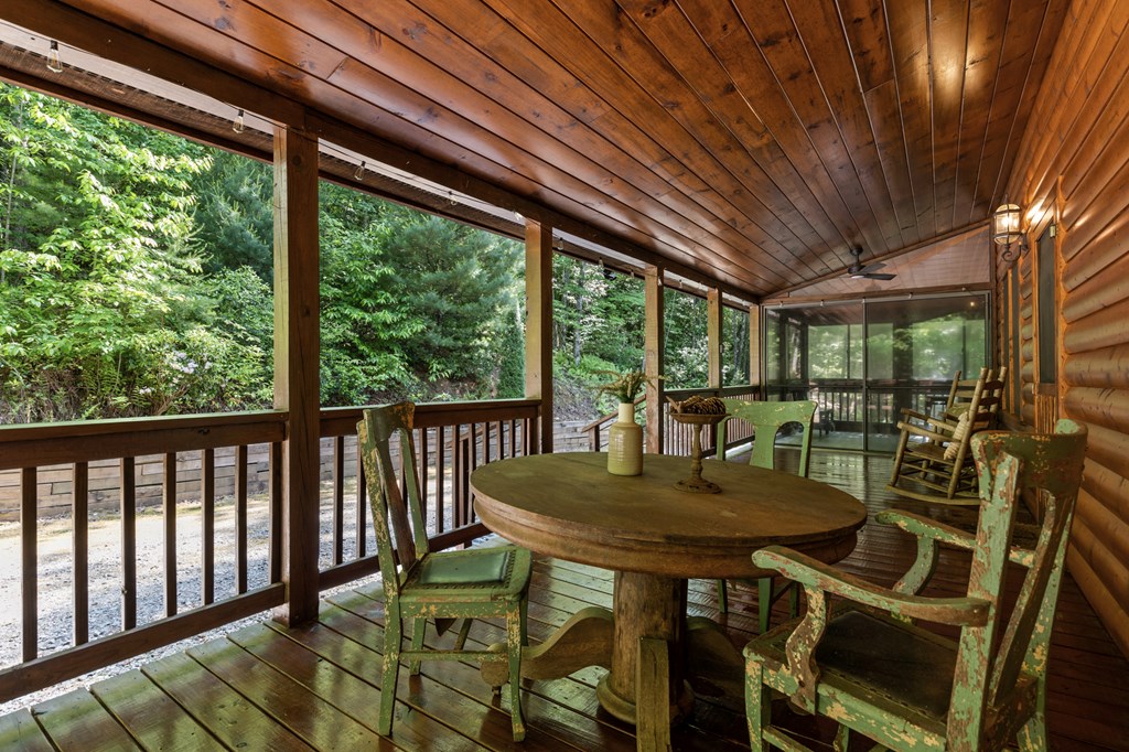 220 Solar Drive Blue Ridge, GA 30513 - Photo 6 of 59 a view of a patio with a table chairs and a table