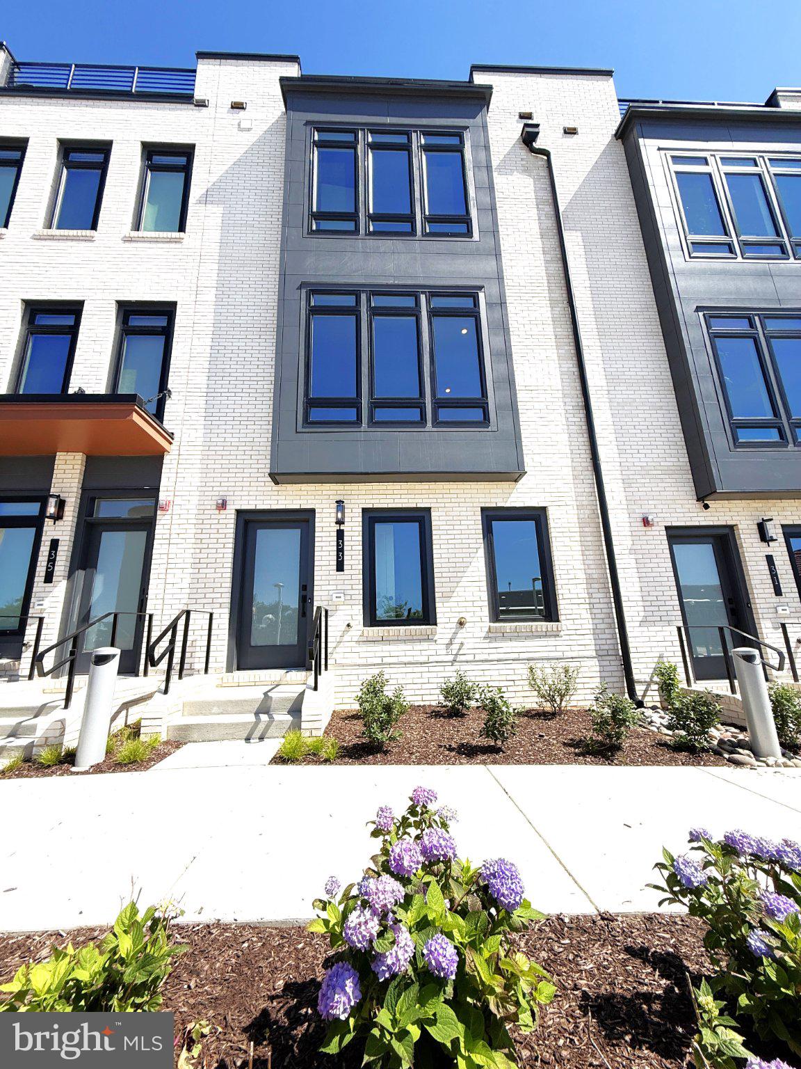 33 Lower Service Court Northwest Washington, DC 20001 - Photo 2 of 51 Modern townhome with vibrant landscaping.
