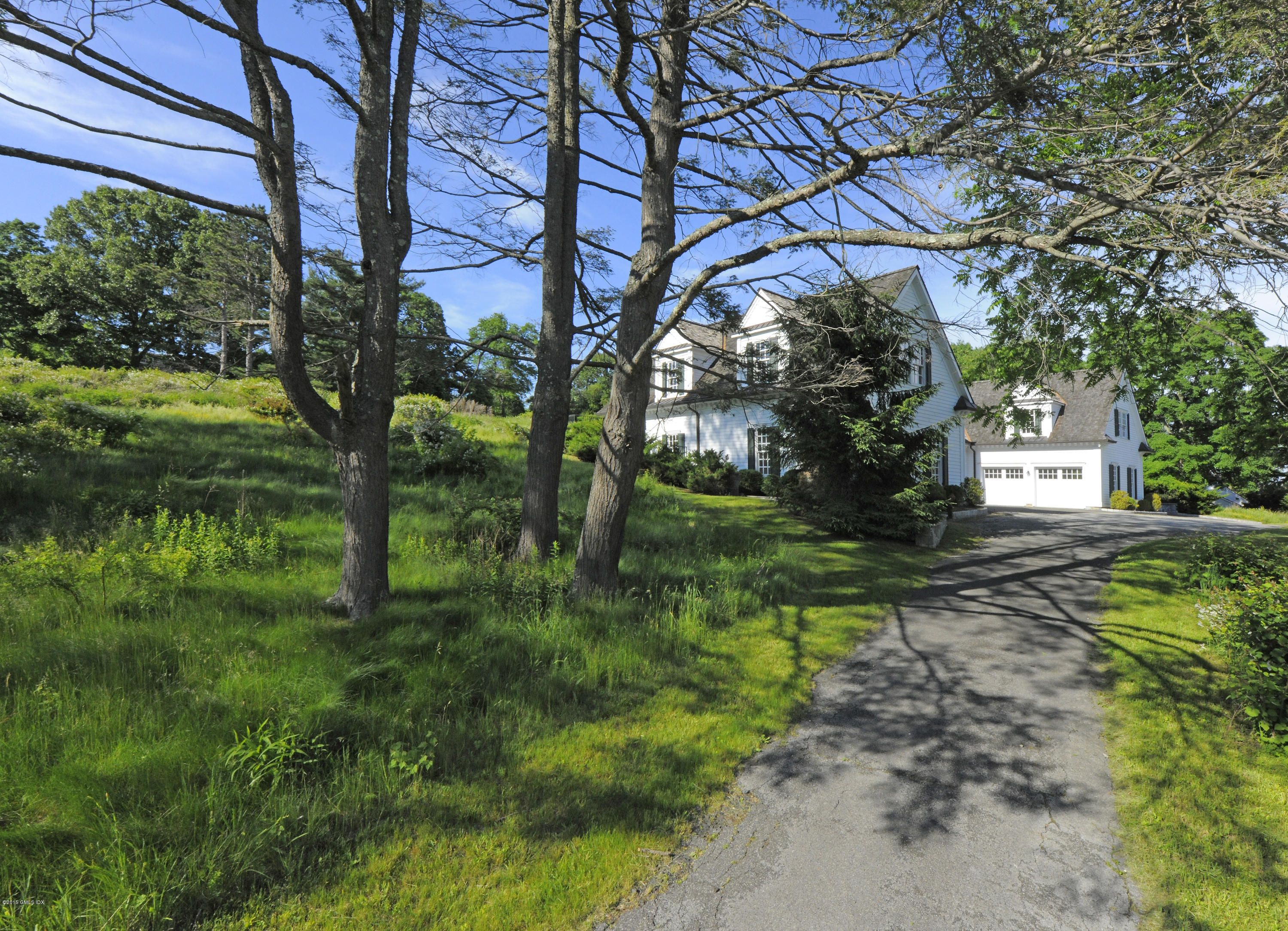 a backyard of a house with lots of green space