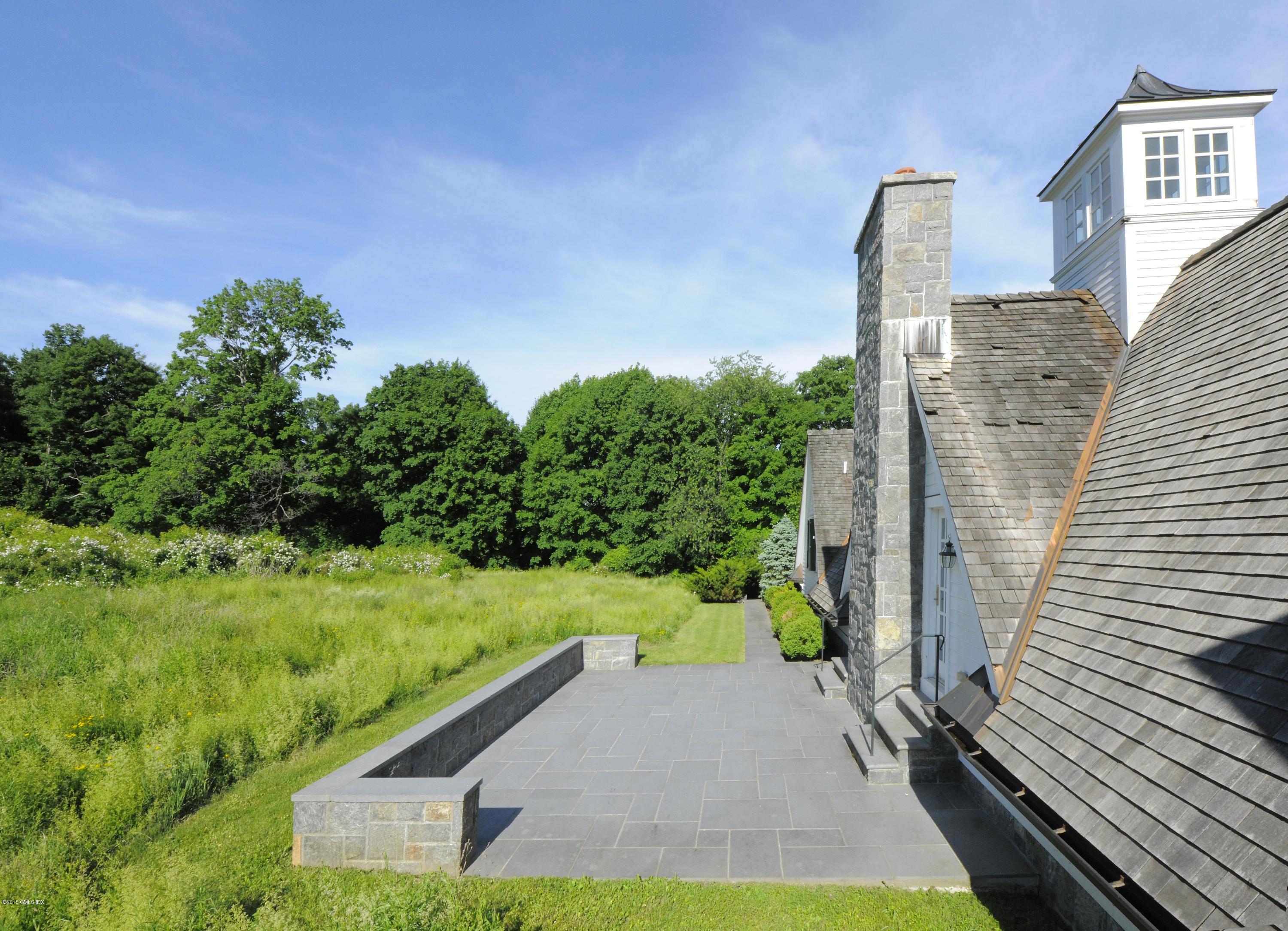 23 Cliffdale Road Greenwich, CT 06831 - Photo 14 of 24 a view of a yard with potted plants