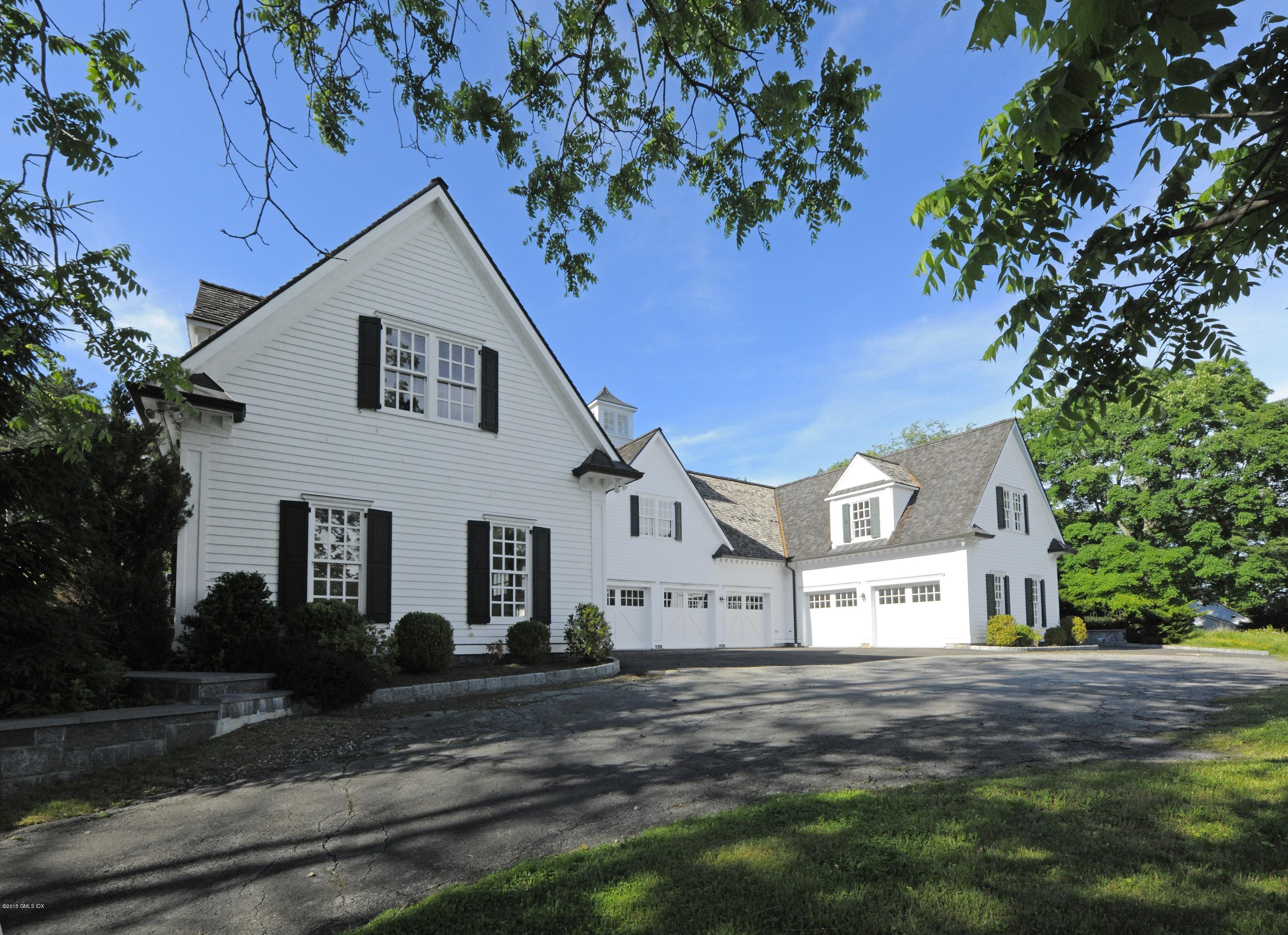 23 Cliffdale Road Greenwich, CT 06831 - Photo 18 of 24 a view of a white house with a yard