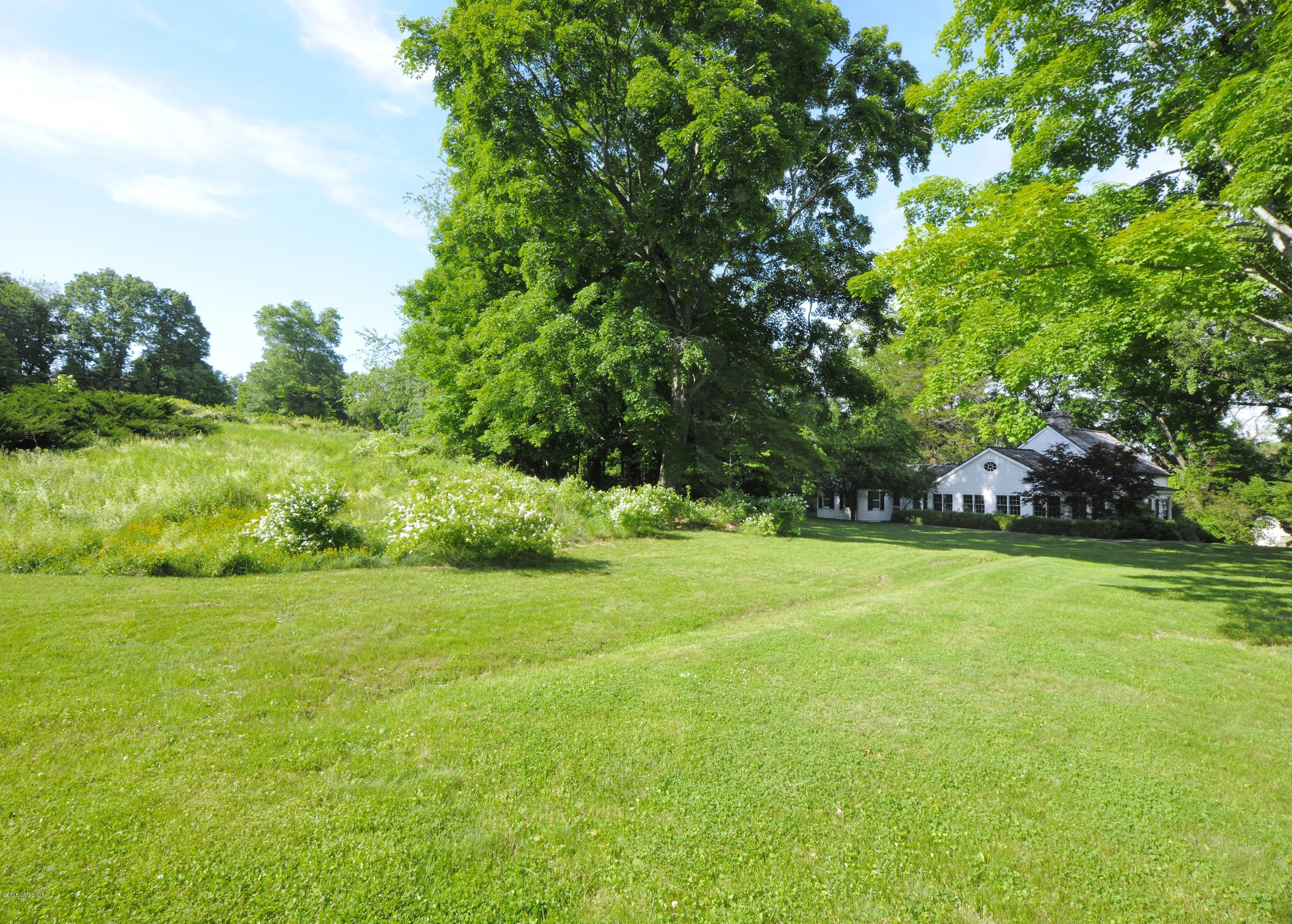 23 Cliffdale Road Greenwich, CT 06831 - Photo 5 of 24 a view of a field with trees in the background