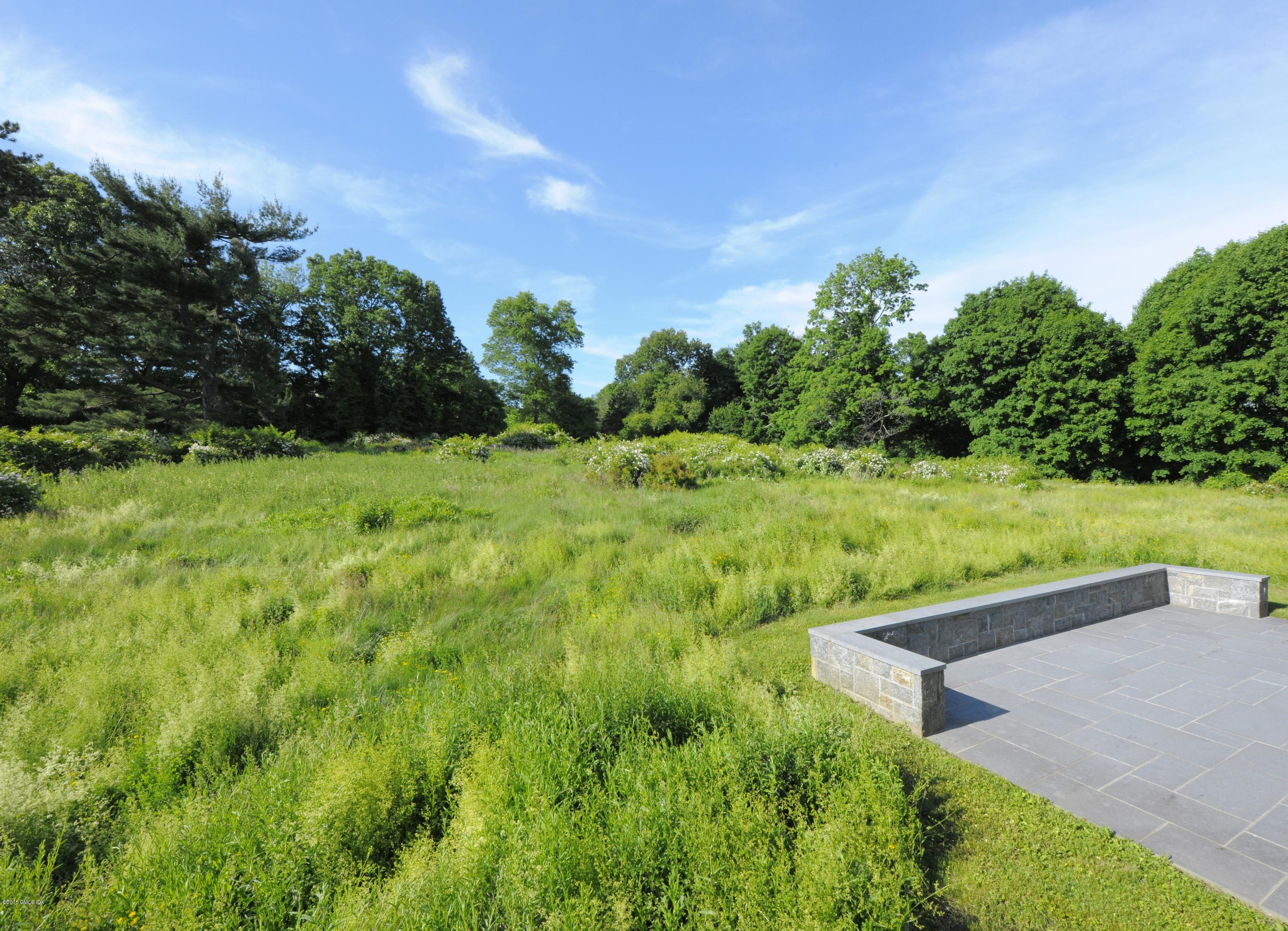 23 Cliffdale Road Greenwich, CT 06831 - Photo 9 of 24 a view of a garden with an outdoor space
